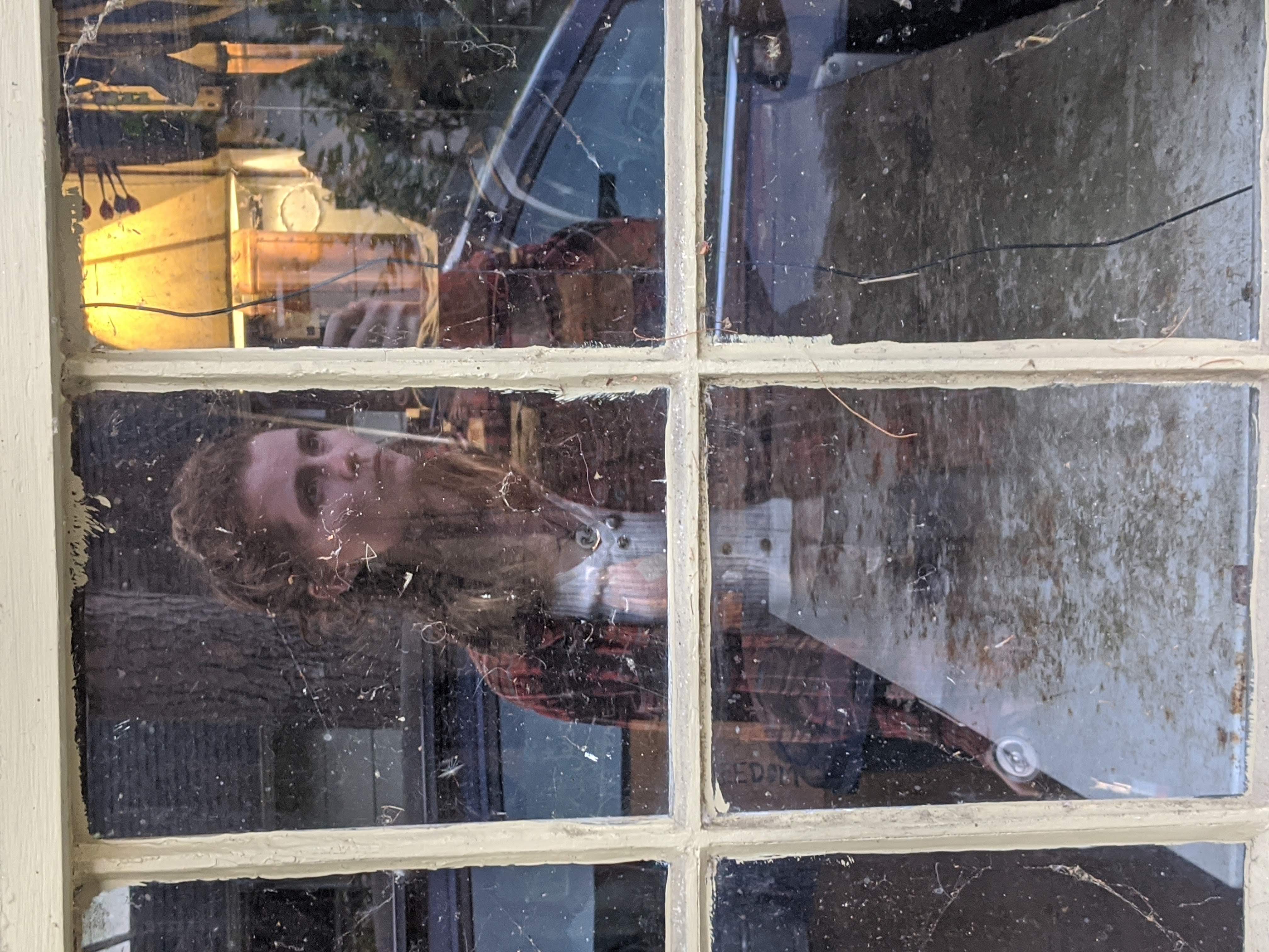Photo of Nissa reflected in a window pane