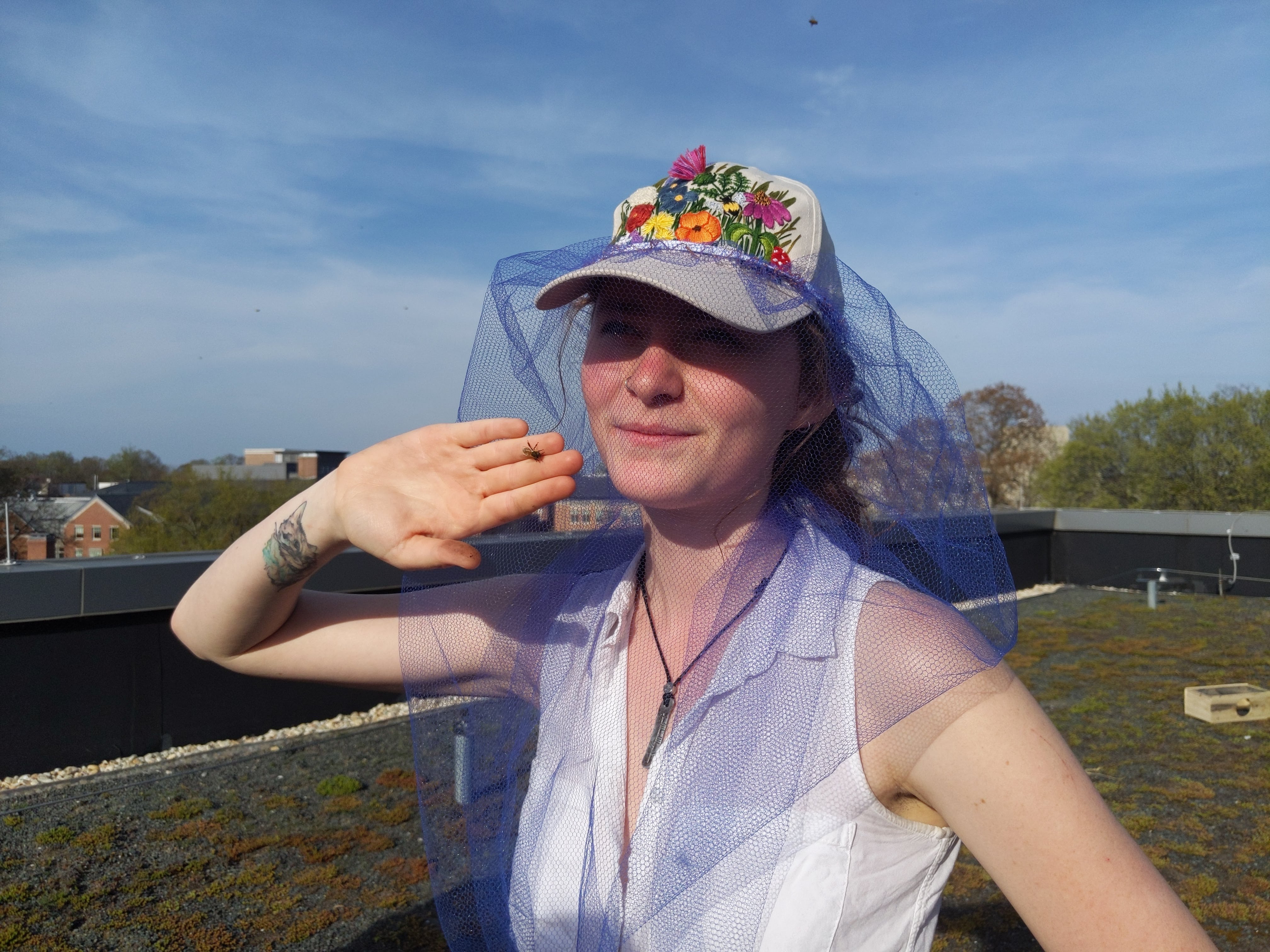 Photo of Nissa with a bee on her hand