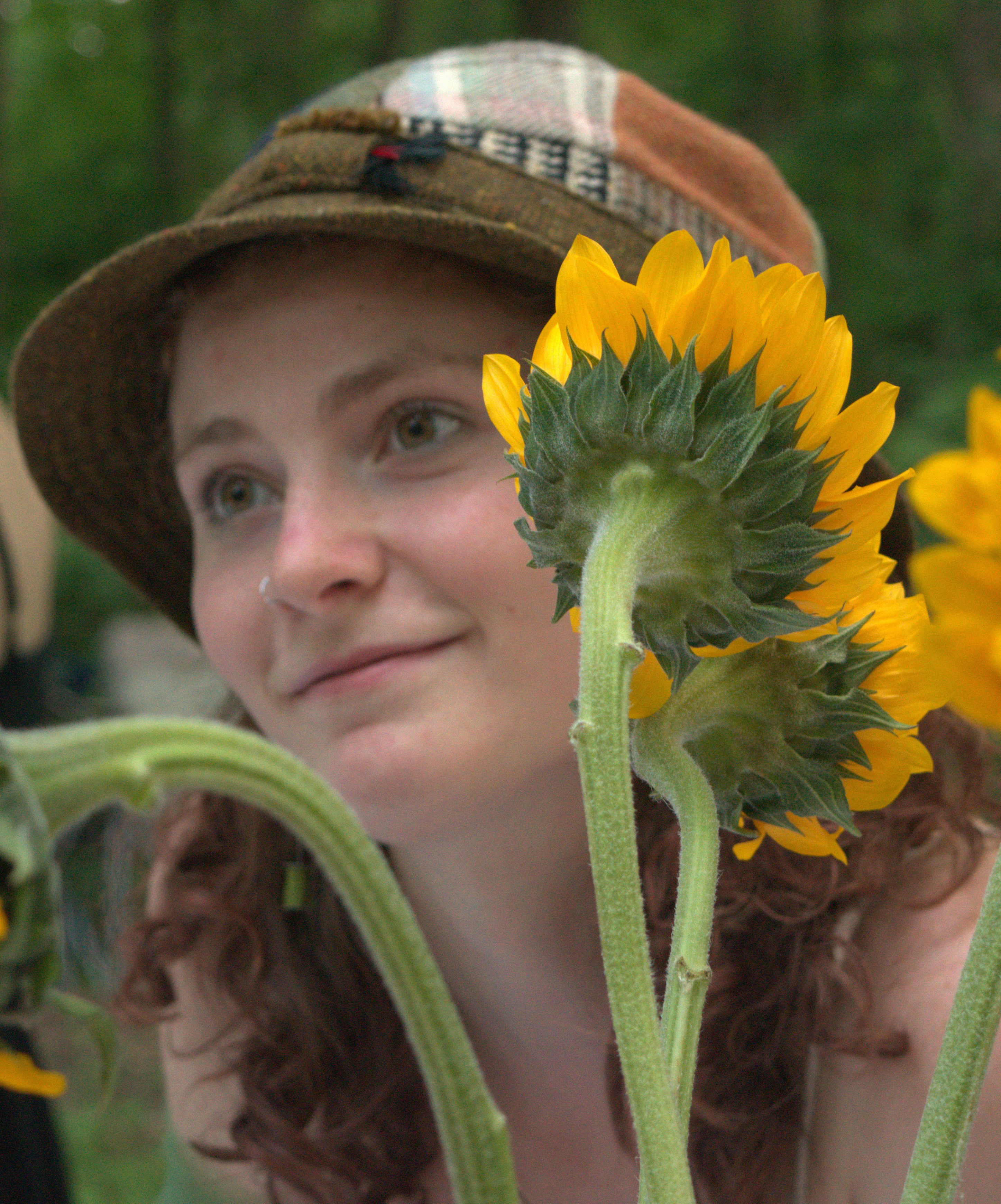 Photo of Nissa with sunflowers around her face